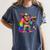 Rainbow Pride Bigfoot Reading Book With Heart Glasses Women's Comfort Colors T-Shirt Moss