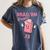Read 'Em Western Cowgirl Retro Groovy Reading Books Women's Comfort Colors T-Shirt Moss