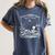 Read In Peace Skeleton Reading Book Halloween Bookish Women's Comfort Colors T-Shirt Moss