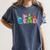 Reading Dinosaur T Rex Dino Book Lover Women's Comfort Colors T-Shirt Moss Reading Dinosaur T Rex Dino Book Lover Women's Comfort Colors T-Shirt Moss