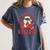 He Sees What You'Ve Been Reading Santa Book Women's Comfort Colors T-Shirt Moss He Sees What You'Ve Been Reading Santa Book Women's Comfort Colors T-Shirt Moss