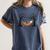 Skeleton Reading Book In Hammock Halloween Reader Women's Comfort Colors T-Shirt Moss