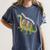 Teachersaurus Dinosaur Teachers Dino Reading Book Librarian Women's Comfort Colors T-Shirt Moss