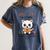 Unearth a Story Cute Kitten Summer Reading 2026 Cat Book Women's Comfort Colors T-Shirt Moss