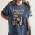 Unearth A Story Dinosaur Reading a Library Book Women's Comfort Colors T-Shirt Moss