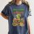 Unearth a Story Triceratops Dinosaur Reading Books Cute Dino Women's Comfort Colors T-Shirt Moss