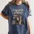Women's Unearth A Story Dinosaur Reading a Library Book Women's Comfort Colors T-Shirt Moss
