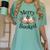 Merry And Booked Holiday Reading Winter Book Lover Premium Tri-Blend Women's Comfort Colors T-Shirt Violet