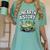 Unearth a Story Frog Reading a Book Summer 2026 Premium Tri-Blend Women's Comfort Colors T-Shirt Violet Unearth a Story Frog Reading a Book Summer 2026 Premium Tri-Blend Women's Comfort Colors T-Shirt Violet