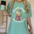 Unearth a Story Summer Reading 2026 Book Lover Dino Fun Women's Comfort Colors T-Shirt Violet Unearth a Story Summer Reading 2026 Book Lover Dino Fun Women's Comfort Colors T-Shirt Violet