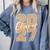 Class Of 2027 Graduation Varsity Orange On The Back Premium Tri-Blend Comfort Colors Sweatshirt Blue Jean