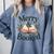 Merry And Booked Holiday Reading Winter Book Lover Premium Tri-Blend Comfort Colors Sweatshirt Denim