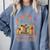 A New Chapter Begins Retired 2025 Books Flowers Comfort Colors Sweatshirt Denim A New Chapter Begins Retired 2025 Books Flowers Comfort Colors Sweatshirt Denim