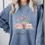 Quote New Chapter Begins Retired 2025 Floral Open Book Comfort Colors Sweatshirt Denim