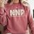 Groovy NNP Neonatal Nurse Practitioner Floral Graduation Comfort Colors Sweatshirt Crimson