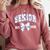 Senior Class Of 2026 Graduation Girly Floral Coquette Bow Comfort Colors Sweatshirt Crimson