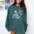 Hilarious Skeleton Holding a Book And Laughing Gothic Comfort Colors Sweatshirt Chalky Mint
