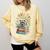 Raccoon Books Reading Flowers Comfort Colors Sweatshirt Blue Spruce Raccoon Books Reading Flowers Comfort Colors Sweatshirt Blue Spruce