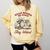 Read Books Be Kind Stay Weird Bookish Cowboy Reading Raccoon Comfort Colors Sweatshirt Blue Spruce