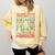 Women's DCC Many Faces Of Mordecai Grid Gamer Series Book Comfort Colors Sweatshirt Blue Spruce Women's DCC Many Faces Of Mordecai Grid Gamer Series Book Comfort Colors Sweatshirt Blue Spruce