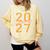 Class Of 2027 Graduation Varsity Orange On The Back Premium Tri-Blend Comfort Colors Sweatshirt Butter