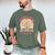 Unearth a Story 2026 Summer Reading Program Flowers Book Premium Tri-Blend Men's Comfort Colors T-Shirt Moss