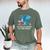 In A World Full Of Bookworms Be A Book Dragon Men's Comfort Colors T-Shirt Moss In A World Full Of Bookworms Be A Book Dragon Men's Comfort Colors T-Shirt Moss