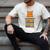 Cute Orange Tabby Cat Reading On Pile Of Books Men's Comfort Colors T-Shirt Ivory