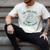 He Sees What You'Ve Been Reading Christmas Bookish Santa Premium Tri-Blend Men's Comfort Colors T-Shirt Ivory