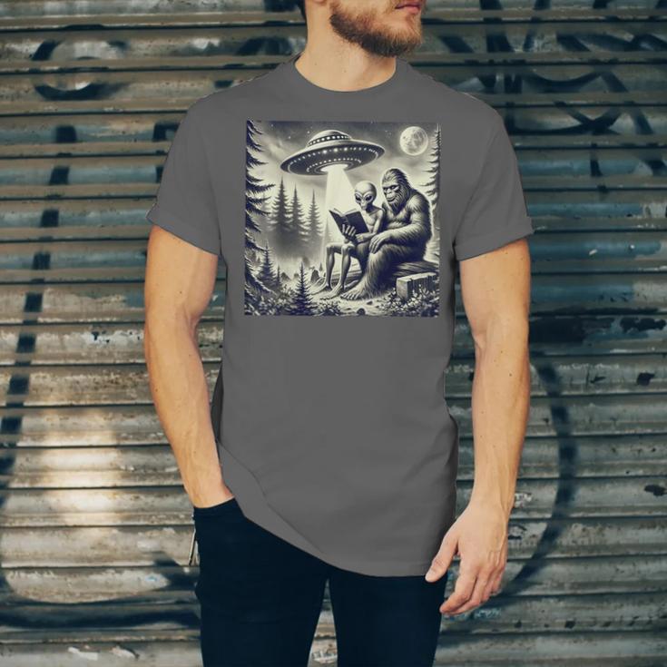 Bigfoot With Alien Reading A Book Bigfoot And UFO Unisex Jersey T-Shirt Bigfoot With Alien Reading A Book Bigfoot And UFO Unisex Jersey T-Shirt