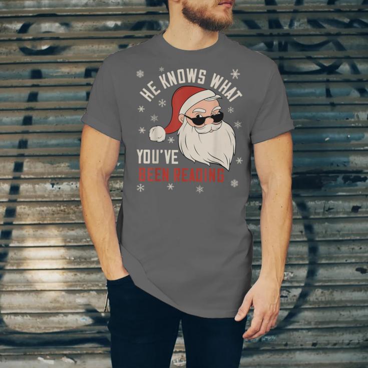 He Knows What You'Ve Been Reading Book Lover Women Santa Unisex Jersey T-Shirt He Knows What You'Ve Been Reading Book Lover Women Santa Unisex Jersey T-Shirt