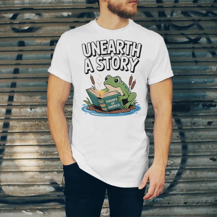 Unearth a Story Frog Reading a Book Summer 2026 Premium Tri-Blend Unisex Jersey T-Shirt Unearth a Story Frog Reading a Book Summer 2026 Premium Tri-Blend Unisex Jersey T-Shirt