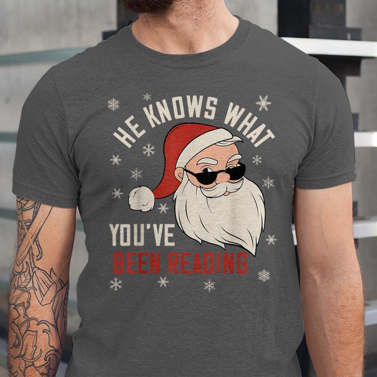 He Knows What You'Ve Been Reading Book Lover Women Santa Unisex Jersey T-Shirt He Knows What You'Ve Been Reading Book Lover Women Santa Unisex Jersey T-Shirt