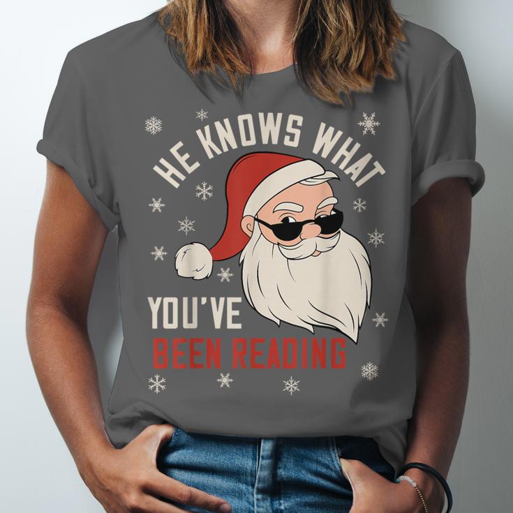 He Knows What You'Ve Been Reading Book Lover Women Santa Unisex Jersey T-Shirt He Knows What You'Ve Been Reading Book Lover Women Santa Unisex Jersey T-Shirt