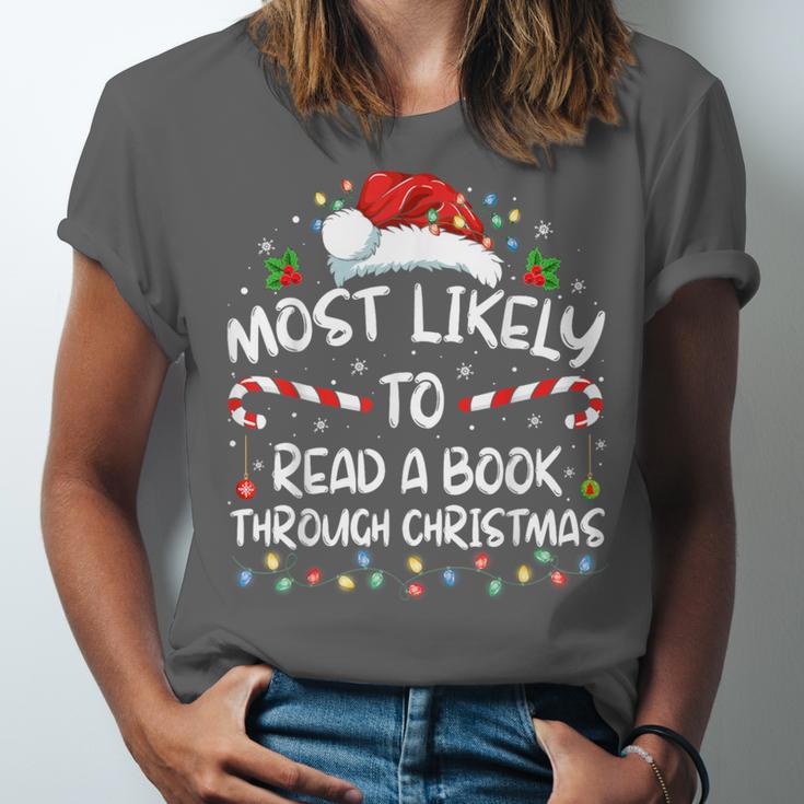 Most Likely To Read A Book Through Christmas Xmas Unisex Jersey T-Shirt Most Likely To Read A Book Through Christmas Xmas Unisex Jersey T-Shirt