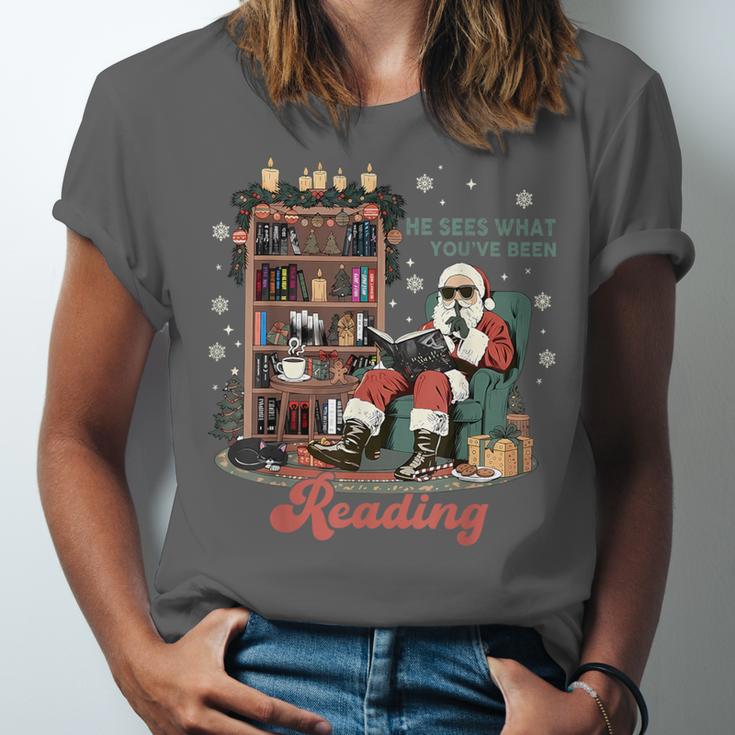 He Sees What You'Ve Been Reading Santa Christmas Bookish Unisex Jersey T-Shirt