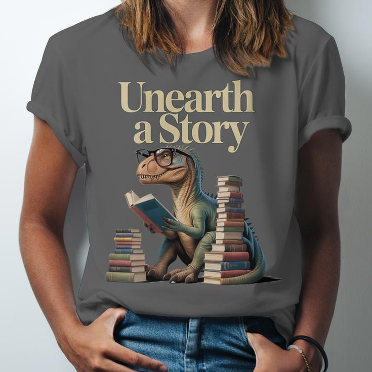 Women's Unearth A Story Dinosaur Reading a Library Book Unisex Jersey T-Shirt