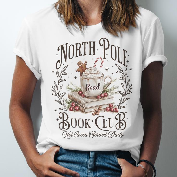 North Pole Book Club Christmas Xmas Hot Cocoa Bookish Unisex Jersey T-Shirt North Pole Book Club Christmas Xmas Hot Cocoa Bookish Unisex Jersey T-Shirt