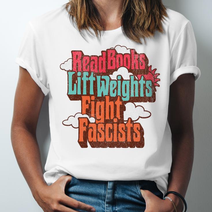 Read Books Lift Weights Fight Fascists Reading No Kings Premium Tri-Blend Unisex Jersey T-Shirt Read Books Lift Weights Fight Fascists Reading No Kings Premium Tri-Blend Unisex Jersey T-Shirt