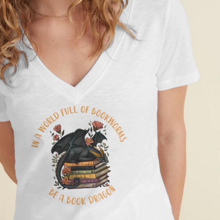 In A World Full Of Bookworms Be A Book Dragon Book Lover Women's Jersey Short Sleeve Deep V-Neck Tshirt