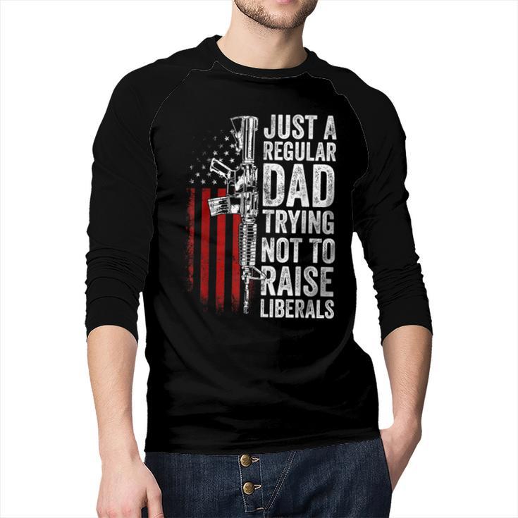 Just A Regular Dad Trying Not To Raise Liberals Father's Day Men Baseball Raglan Shirt