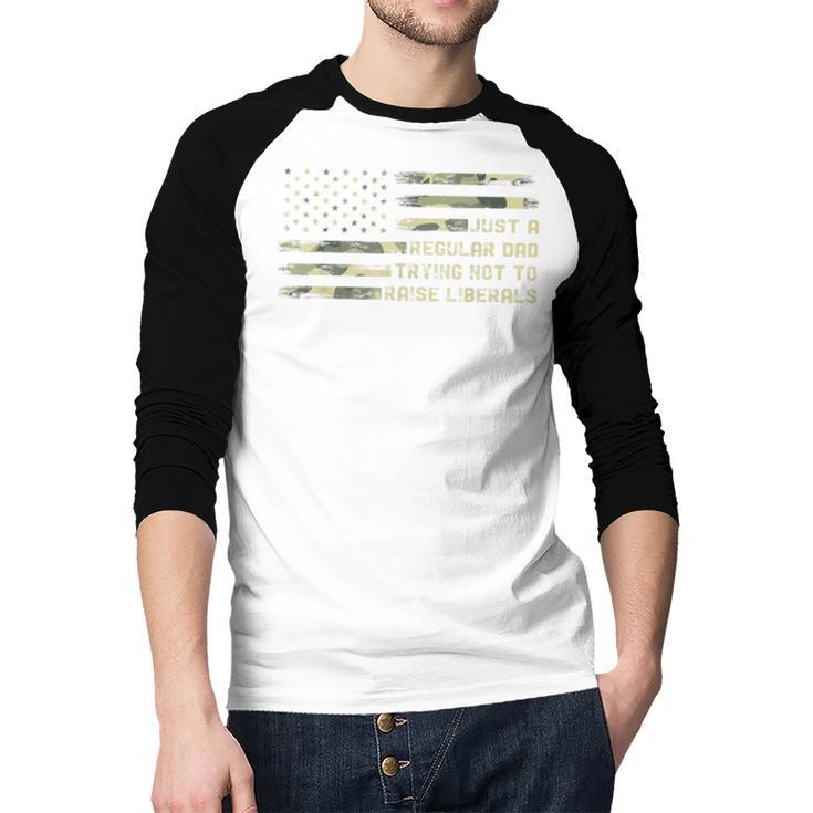 Just a Regular Dad Trying Not To Raise Liberals Camouflage Men Baseball Raglan Shirt