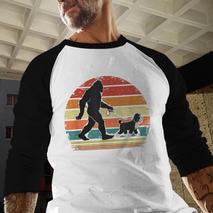 Bigfoot Walking a Dog Bernedoodle Dog Dad Men Baseball Raglan Shirt