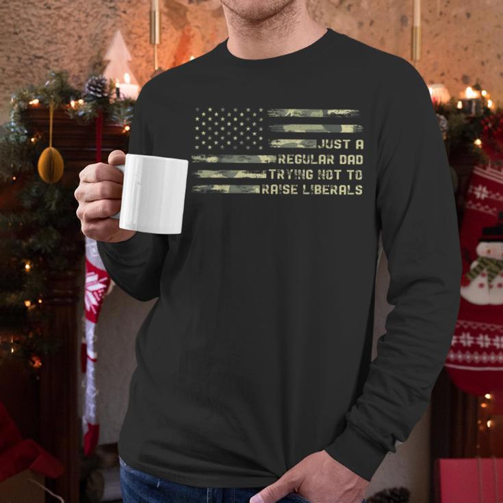Just a Regular Dad Trying Not To Raise Liberals Camouflage Men Long Sleeve T-Shirt