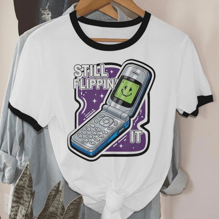 Still Flippin' It Retro Flip Phone 90s Y2K Nostalgia Unisex Cotton Ringer T-Shirt Still Flippin' It Retro Flip Phone 90s Y2K Nostalgia Unisex Cotton Ringer T-Shirt
