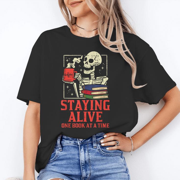 Staying Alive One Book At A Time Skeleton Reading Librarian Unisex T-Shirt Staying Alive One Book At A Time Skeleton Reading Librarian Unisex T-Shirt
