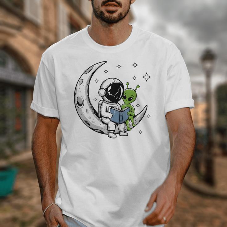 Astronaut Reading Book To Alien Moon Space Astronomy Unisex T-Shirt