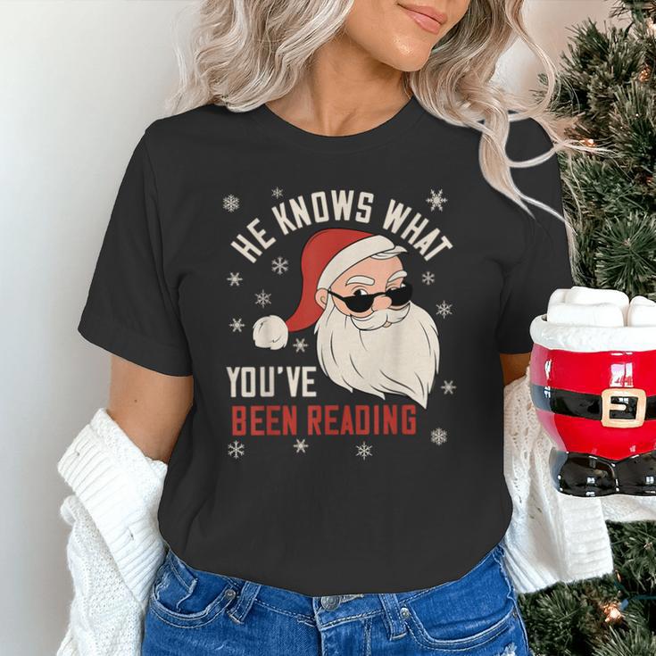 He Knows What You'Ve Been Reading Book Lover Women Santa Unisex T-Shirt He Knows What You'Ve Been Reading Book Lover Women Santa Unisex T-Shirt
