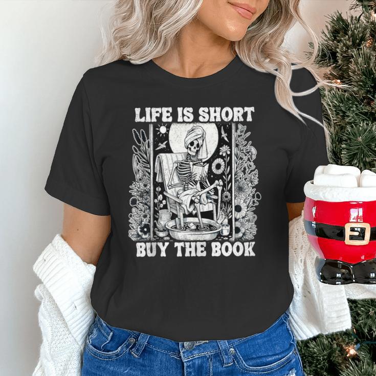 Life Is Short Buy The Book Introvert Skeleton Reading Unisex T-Shirt Life Is Short Buy The Book Introvert Skeleton Reading Unisex T-Shirt