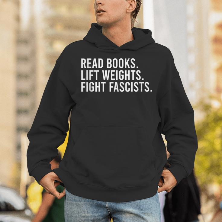 Read Books Lift Weights Fight Fascists Reading Activism Unisex Hoodie Read Books Lift Weights Fight Fascists Reading Activism Unisex Hoodie